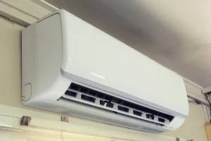 Indoor wall-mounted mini split ac and heat unit providing ductless heating and cooling