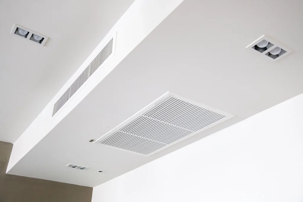 Ceiling return grille and vents connected to a ducted mini split system