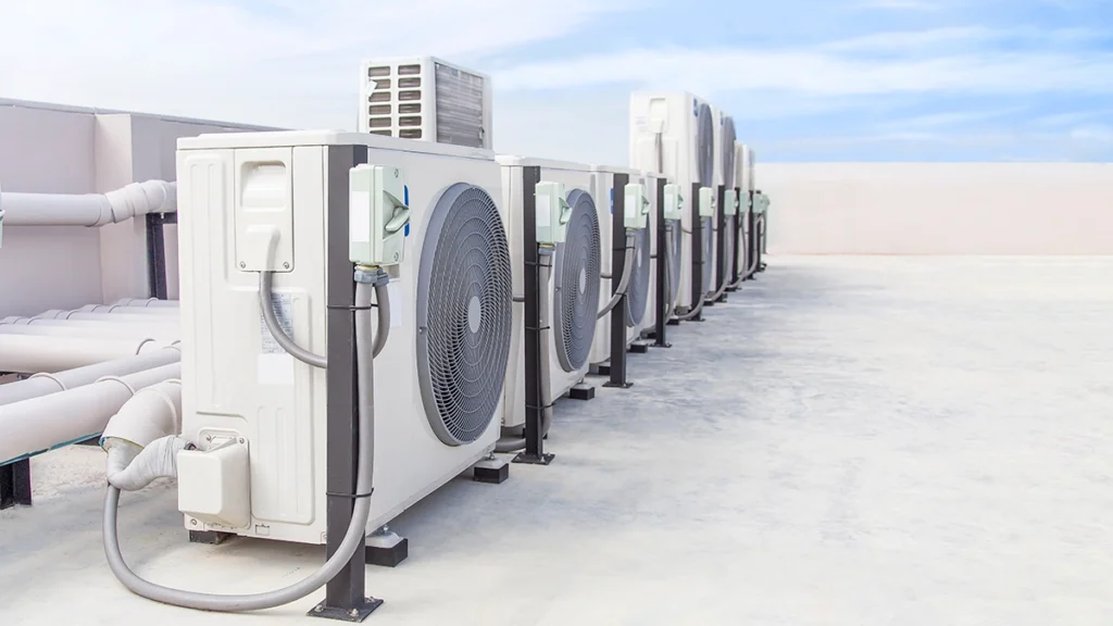 Rooftop commercial HVAC units shown in a row for commercial HVAC maintenance and system service