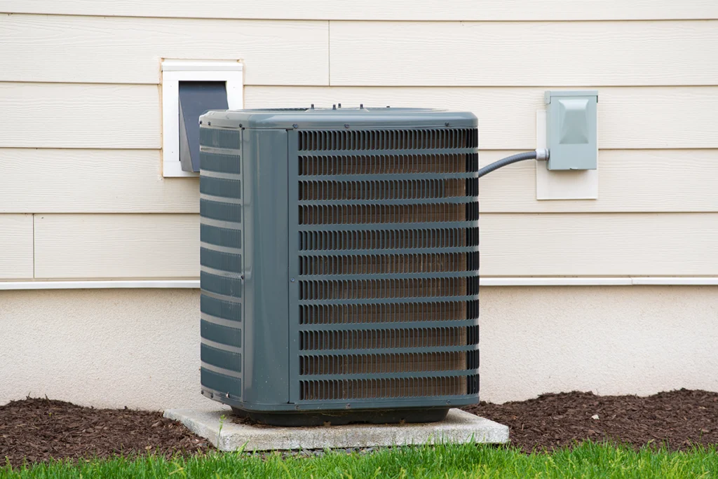AC condenser unit installed outside a home in Tyler, TX.